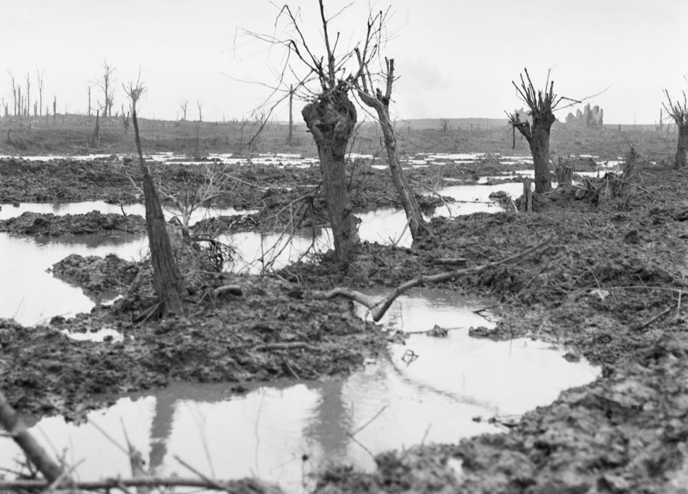 The swamp-like conditions of Zonnebeke during the battle of Passchendaele, 1917. The ruins of the Zonnebeke Church can be seen in the background. 